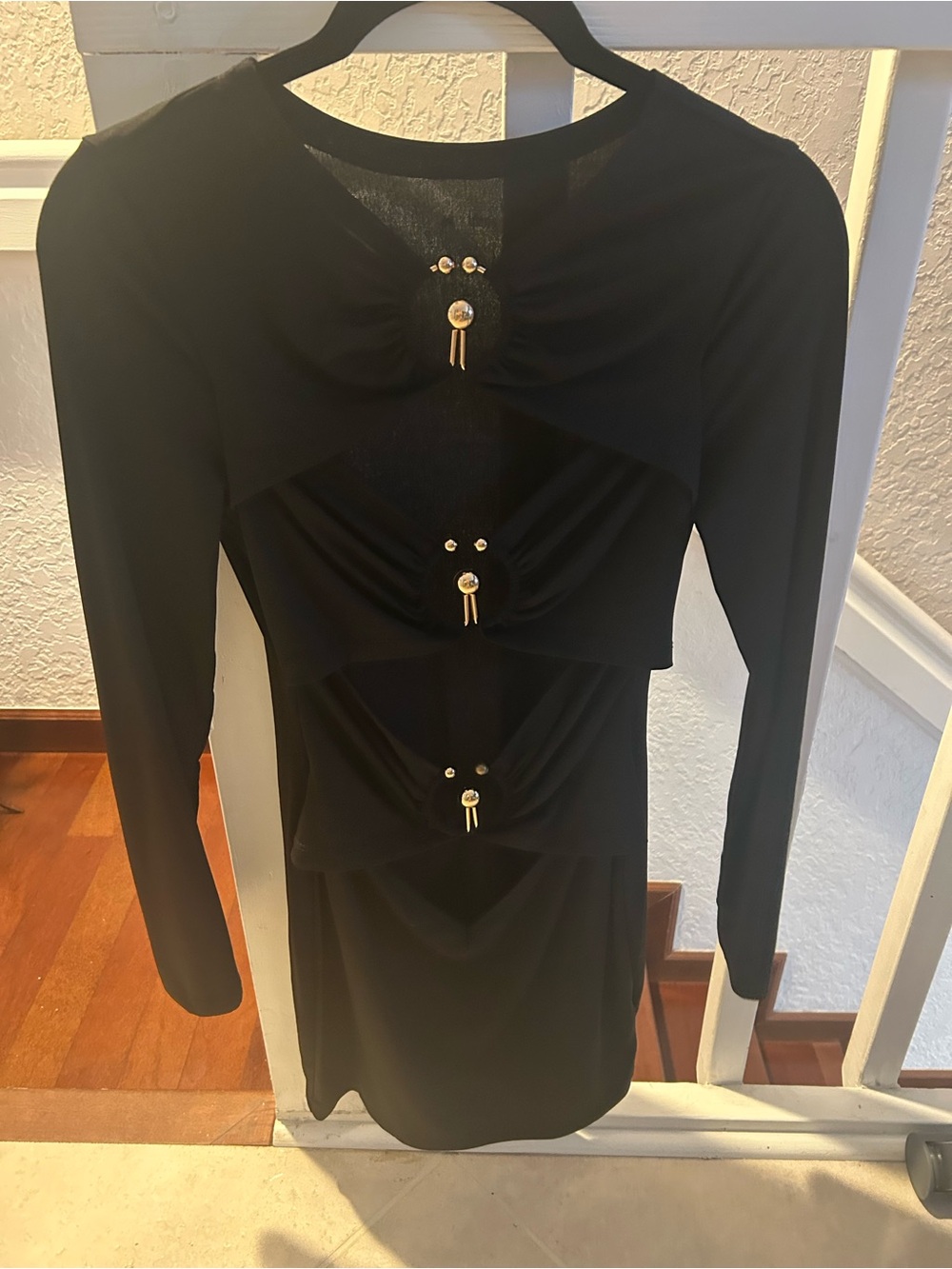 Elegant Black Long-Sleeve Tiered Dress with Decorative Accents